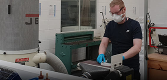 a man standing in front of a computer