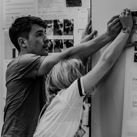 a man standing in front of a refrigerator