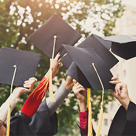 students carrying hat