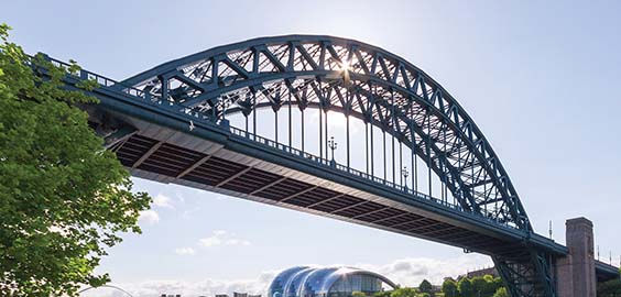 a train crossing a bridge over a river