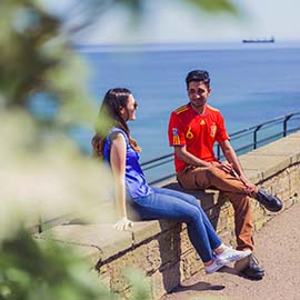 a man sitting in a field