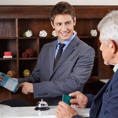 Hotel worker helping a customer 