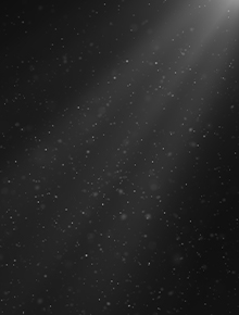 Light shining to expose dust on black background