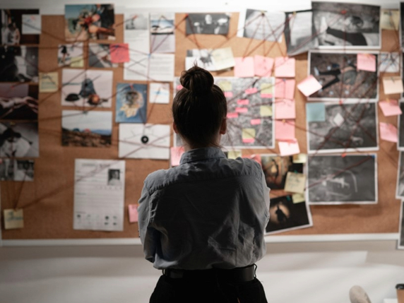 person stood in front of picture board