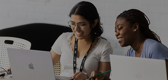 students looking at laptops