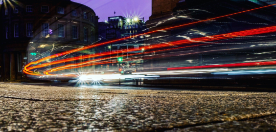 image of red car lights zooming