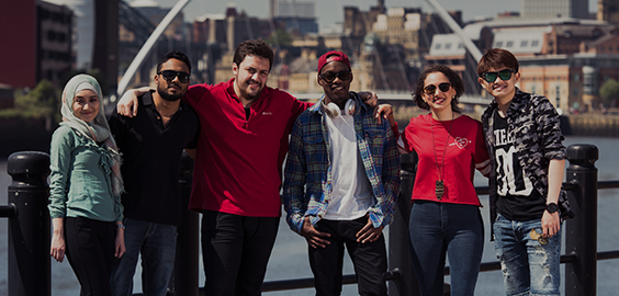 a group of people posing for the camera