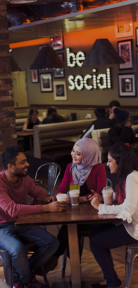 a group of people sitting at a table