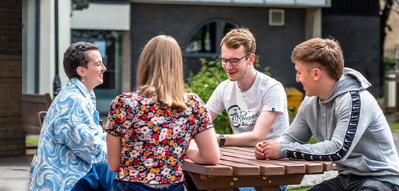 Group of Northumbria University Law students sitting together around a table