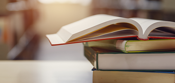A stack of Northumbria Universities books 