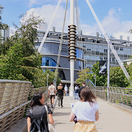 group of students walking towards Northumbria University city campus