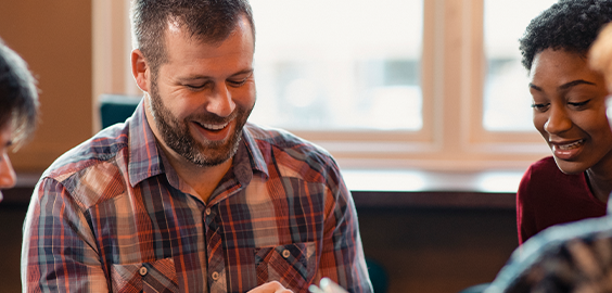 postgraduate male smiling downwards