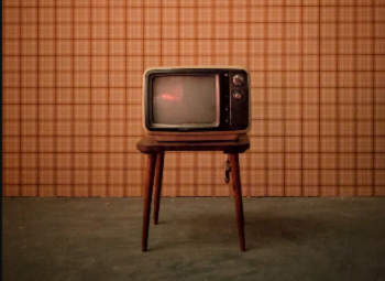 old tv sat on a small table