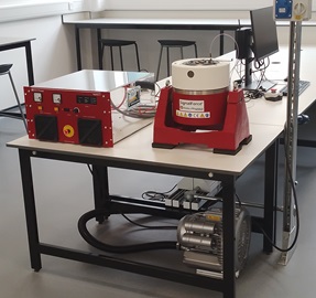 A small, red vibration system.