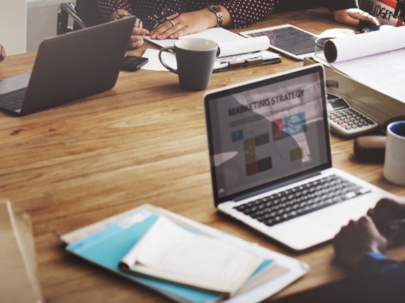 laptops and notepads on a table
