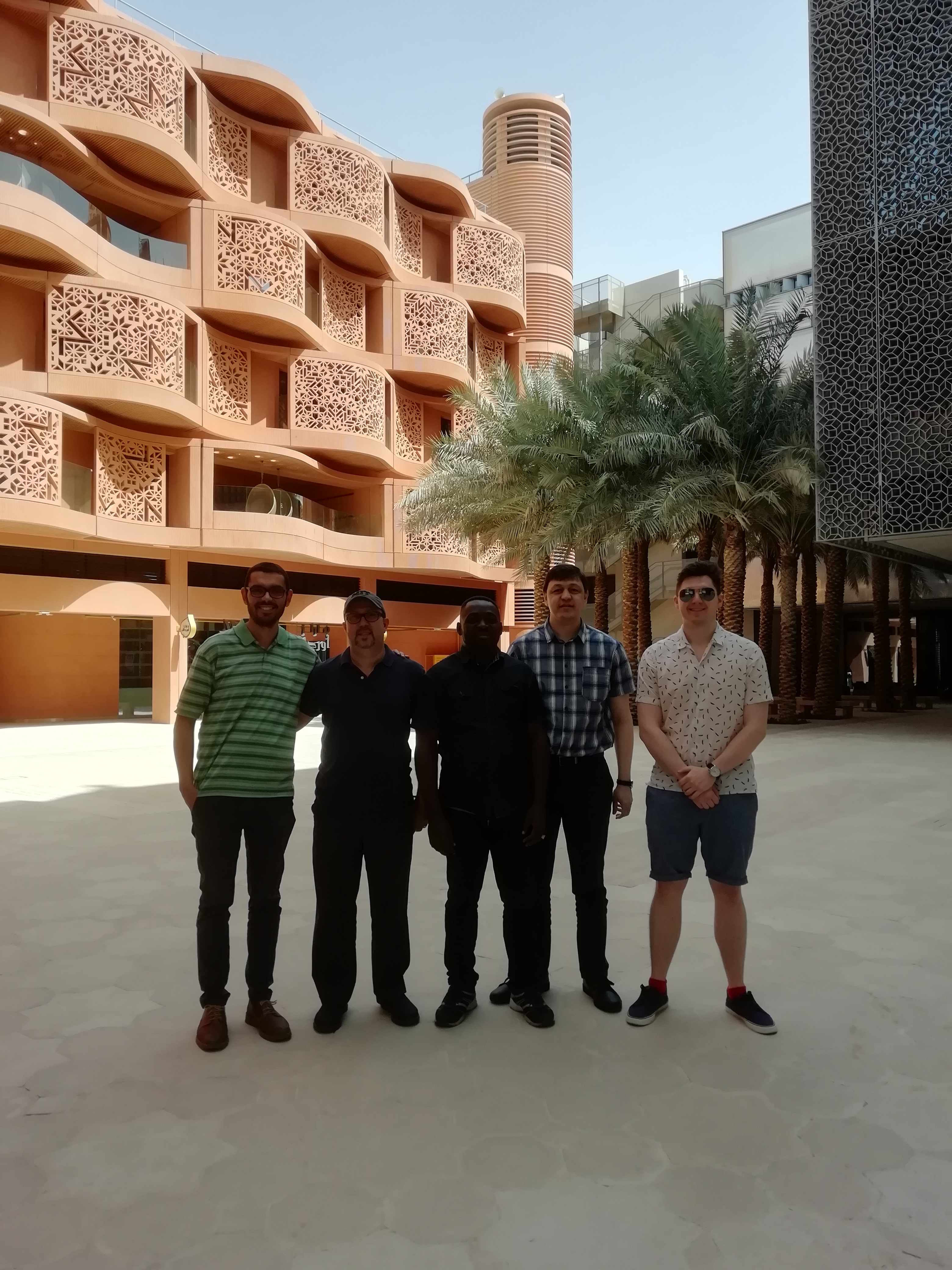 a group of people standing in front of a building