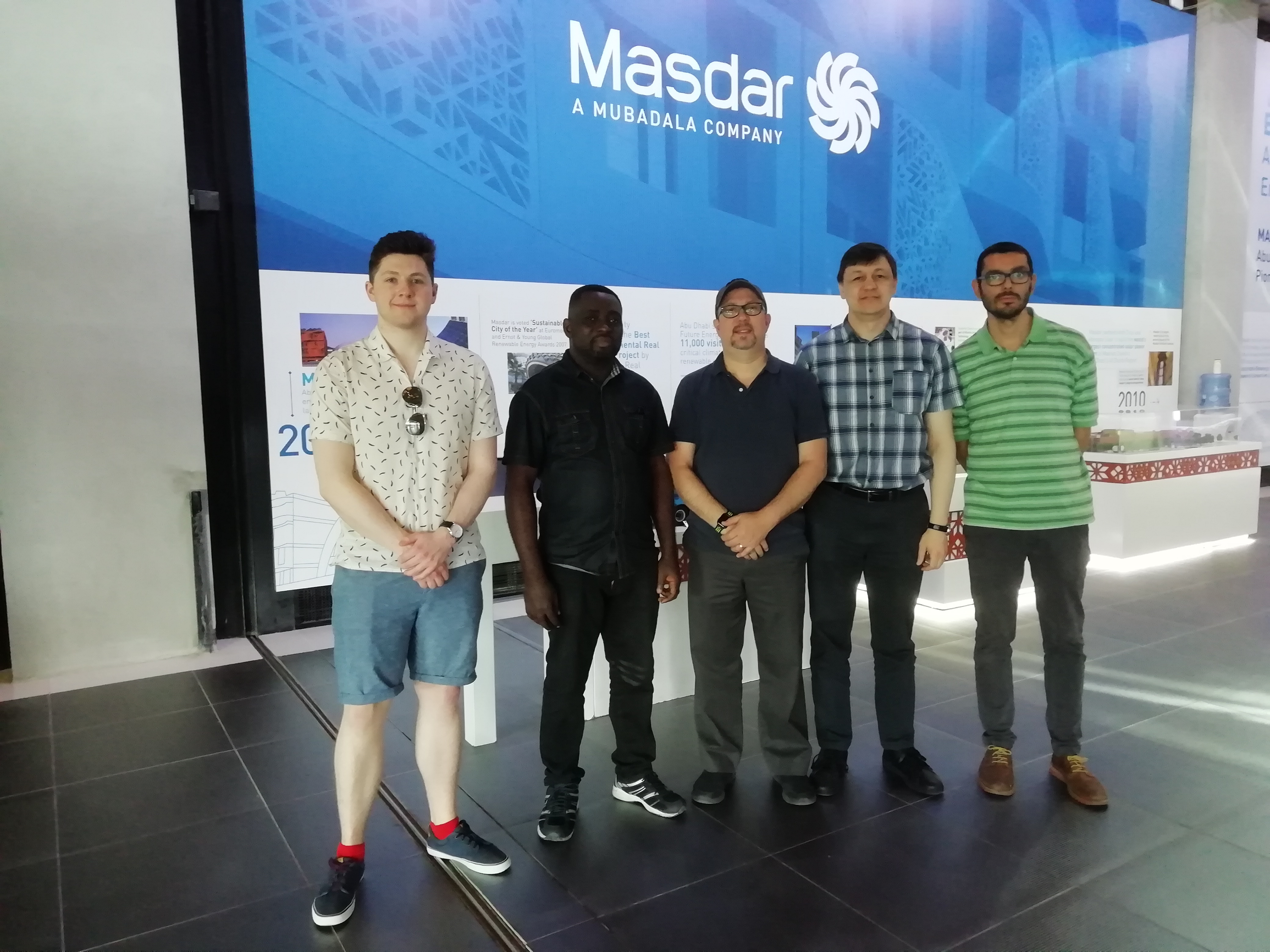 a group of people posing for the camera