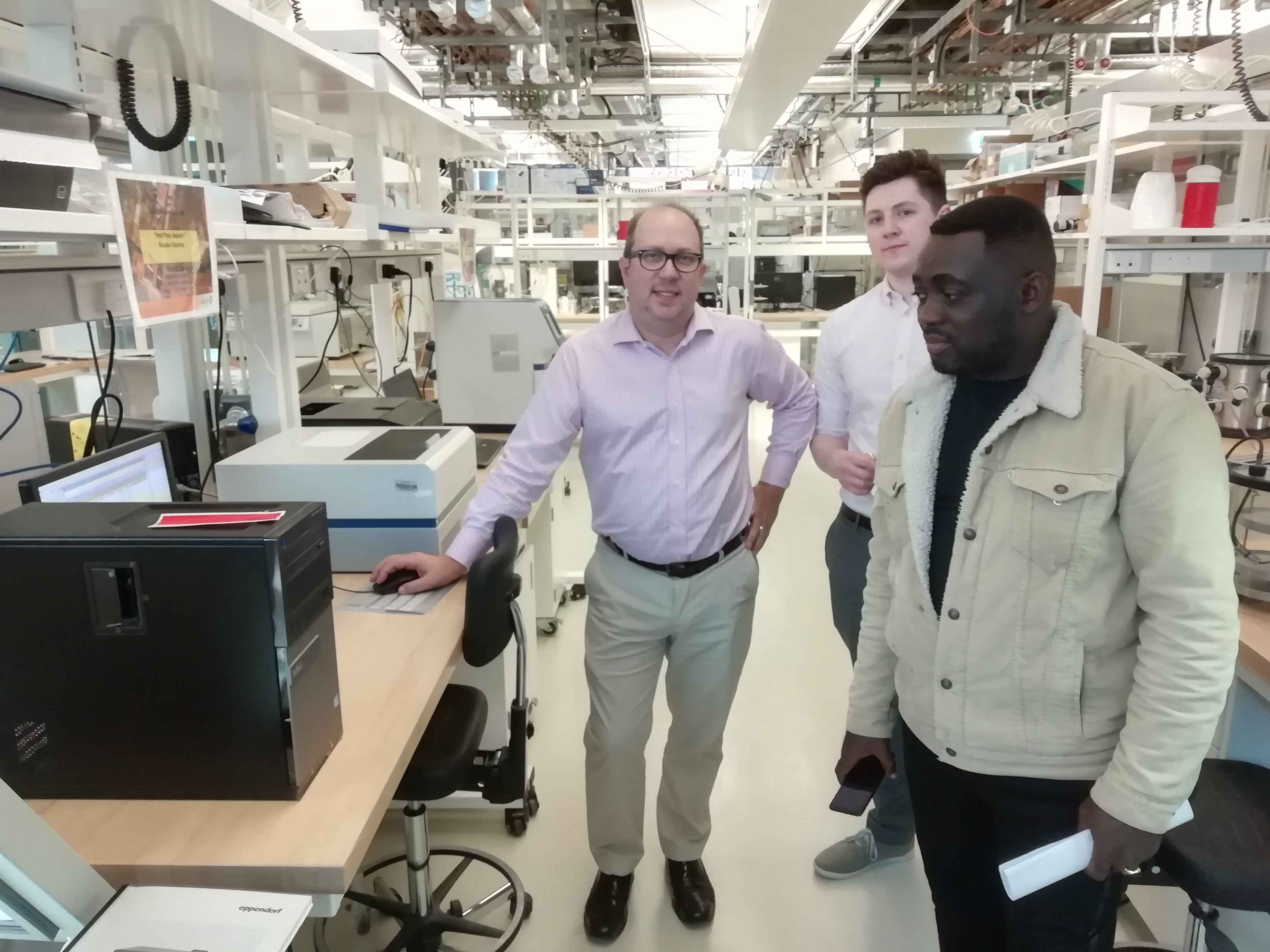 Hector H. Hernandez, Kieran Doyle standing in a kitchen