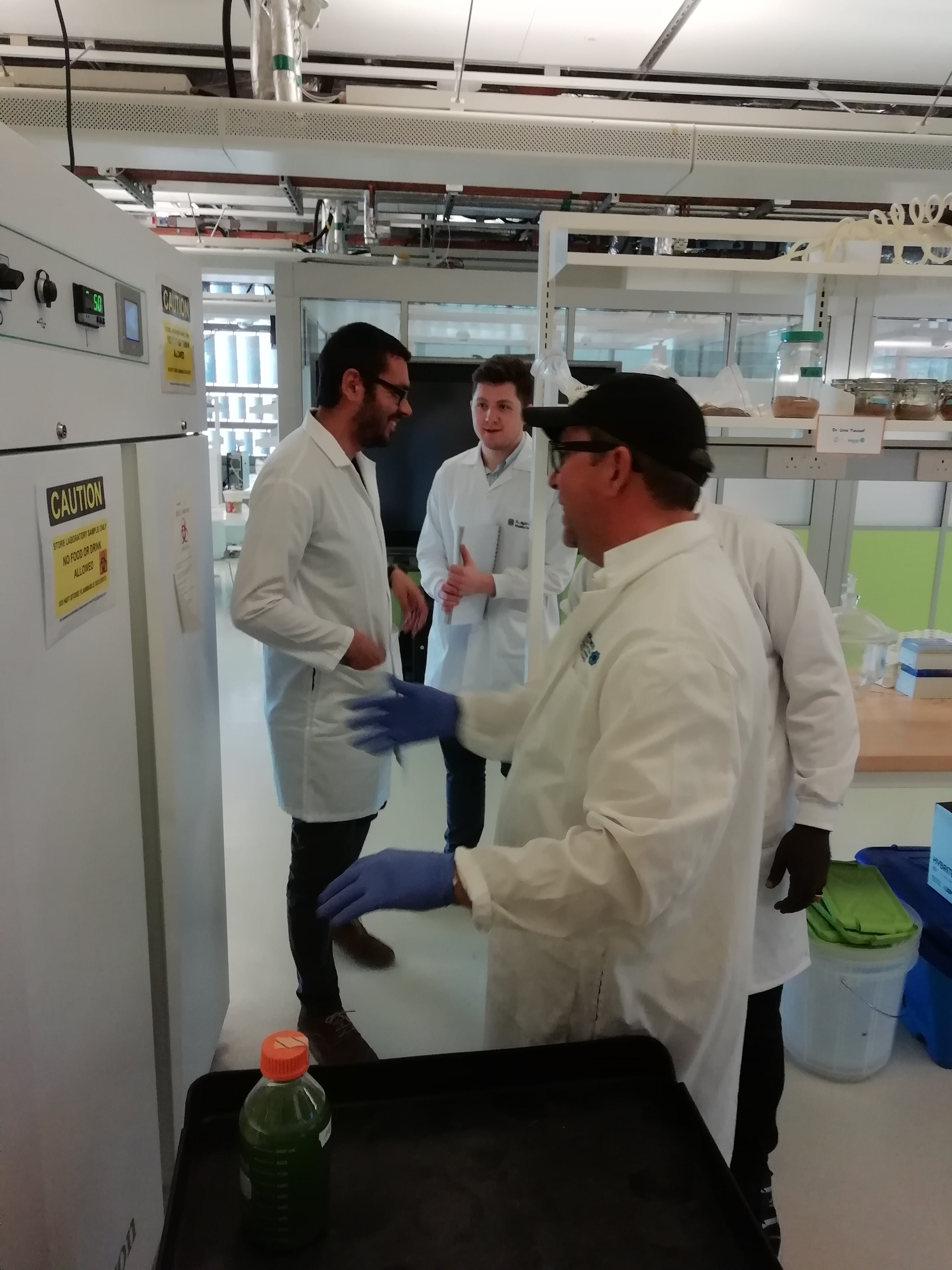 a man and a woman standing in a kitchen