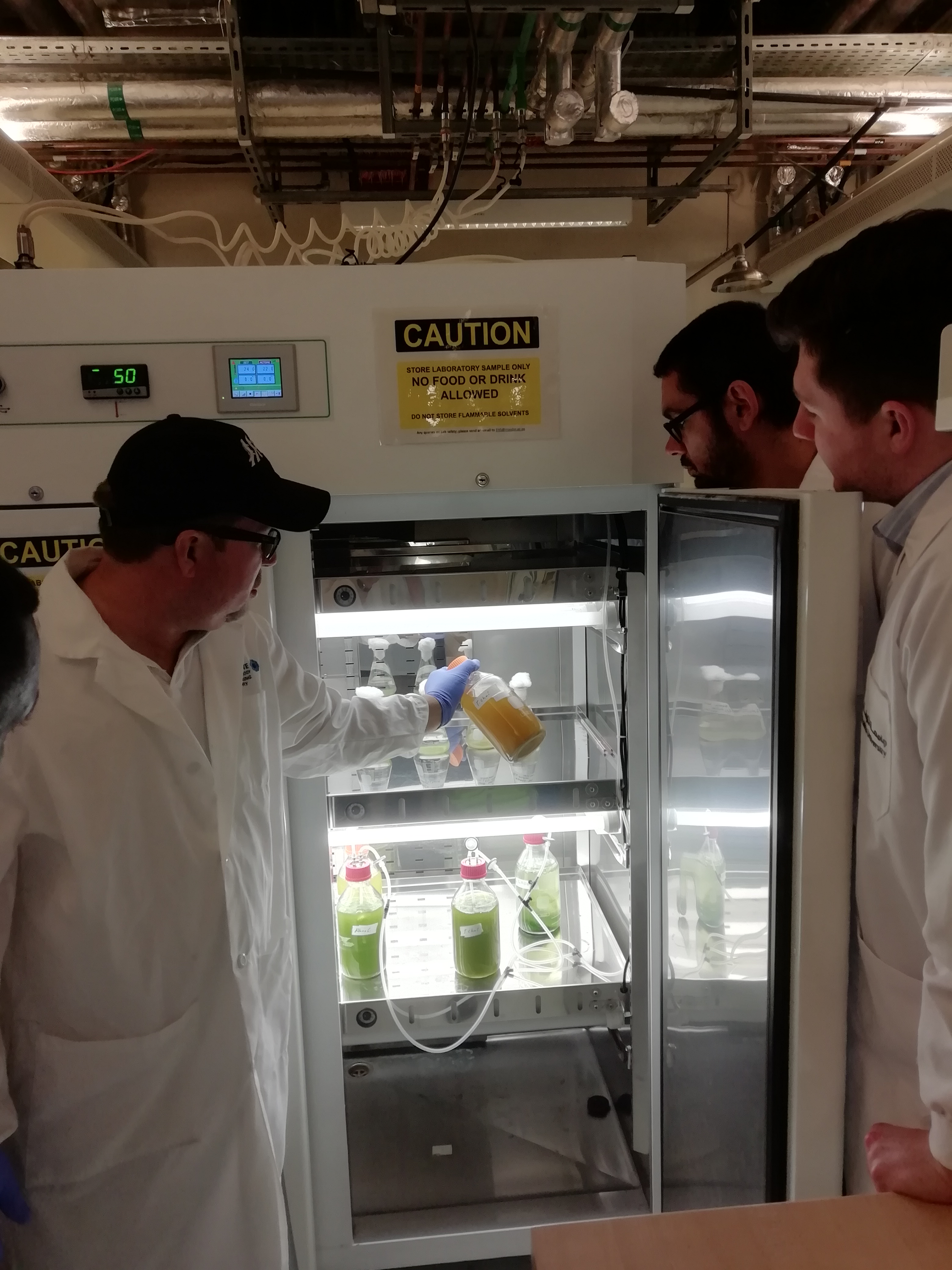 a man standing in front of a refrigerator