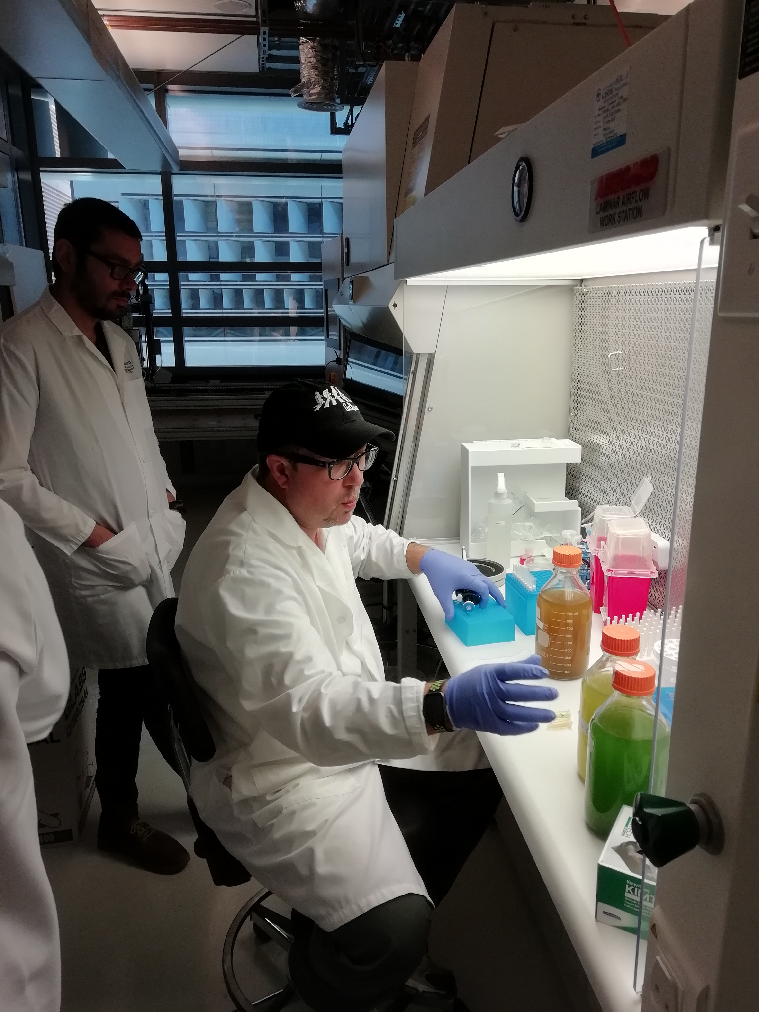 a man standing in front of a refrigerator