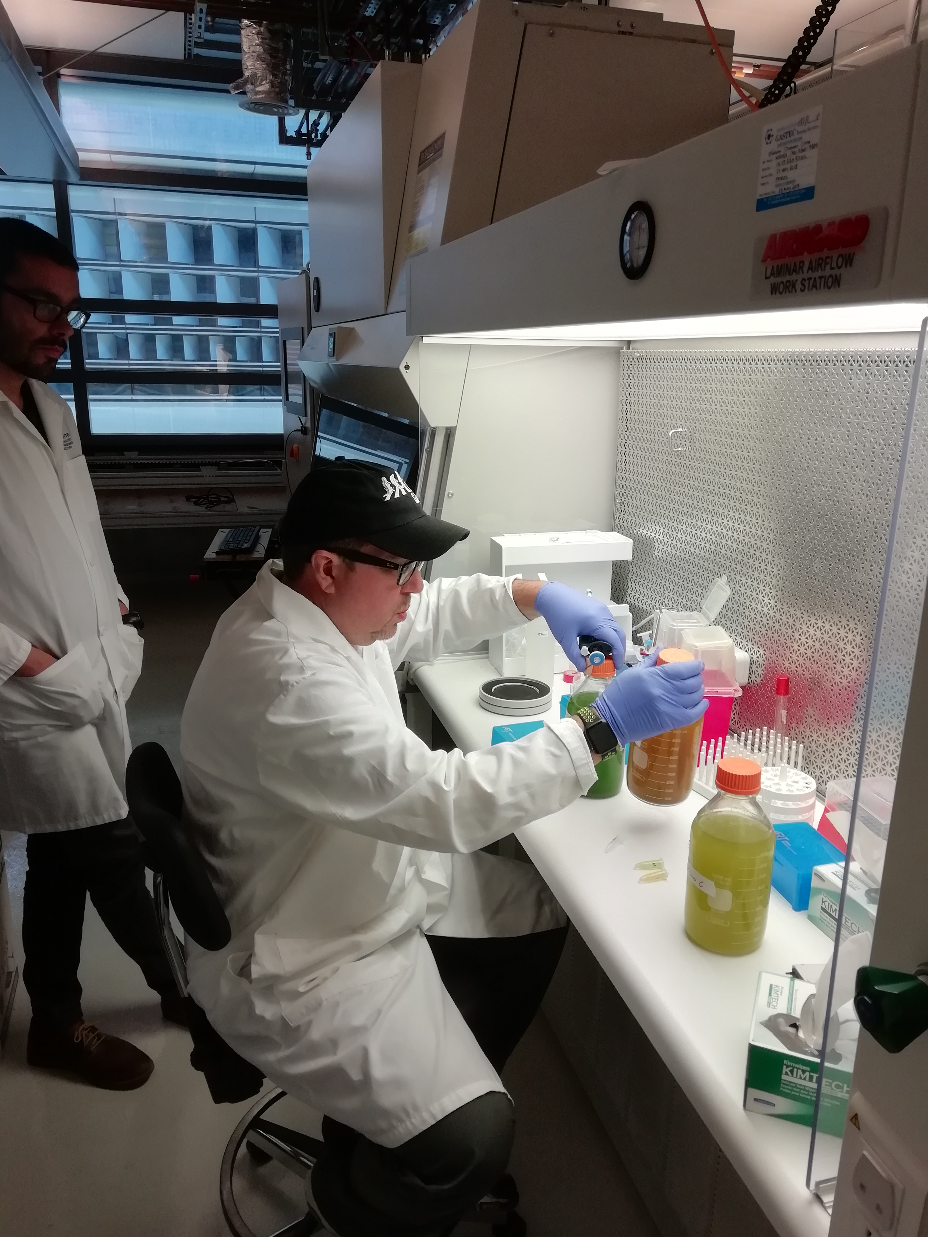 a man standing in front of a refrigerator