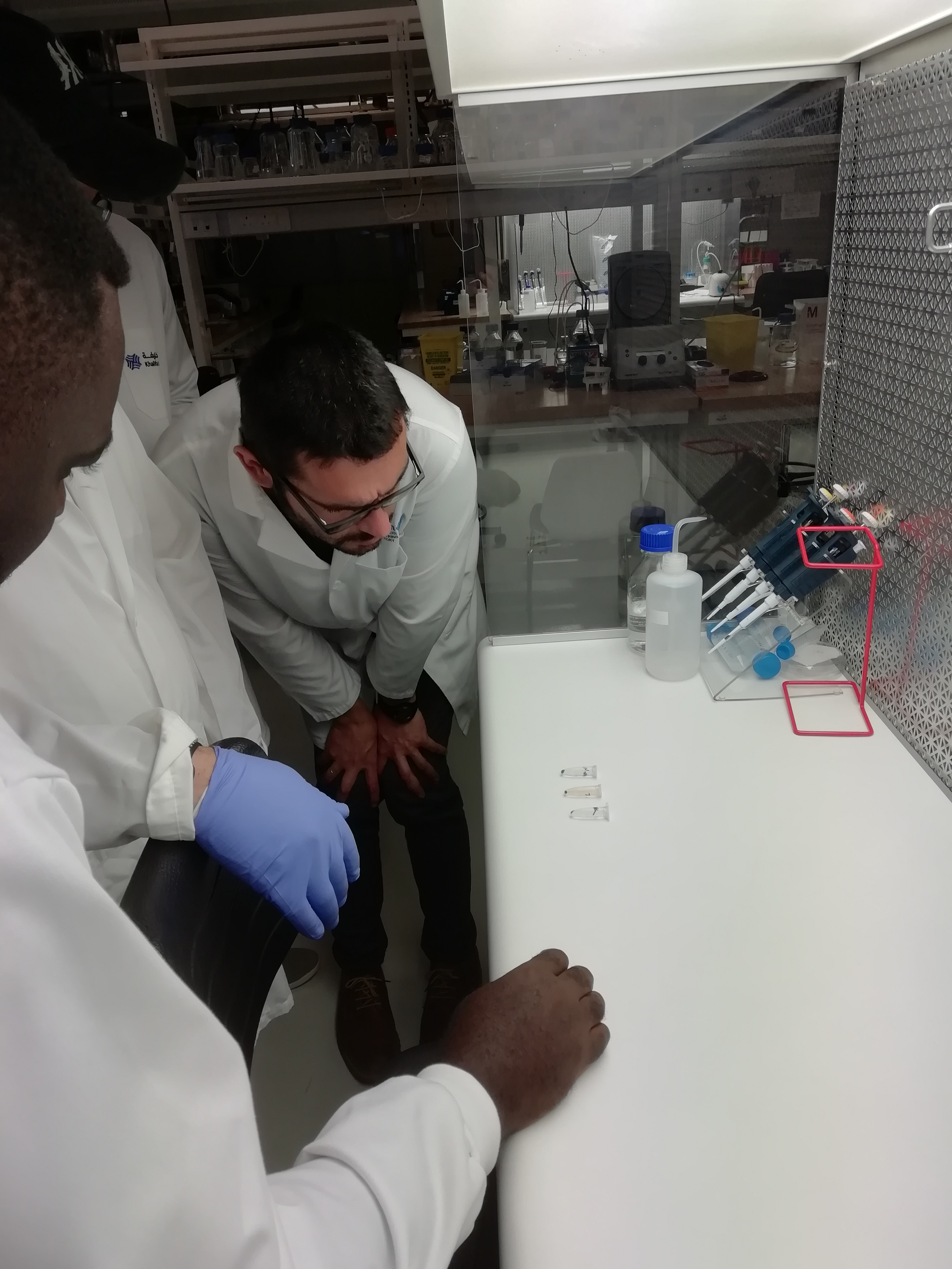 a man standing in front of a refrigerator