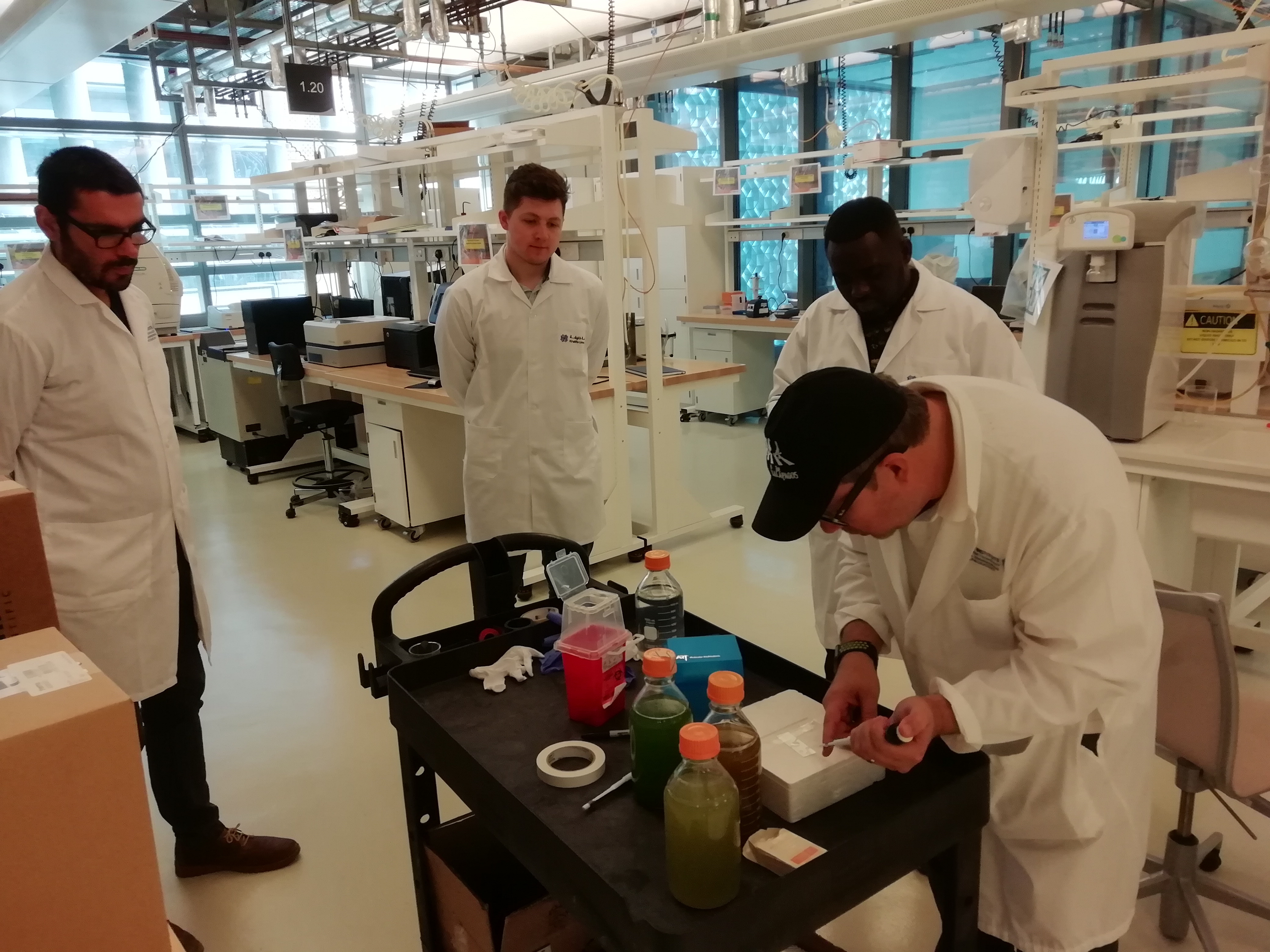 a group of people preparing food in a kitchen