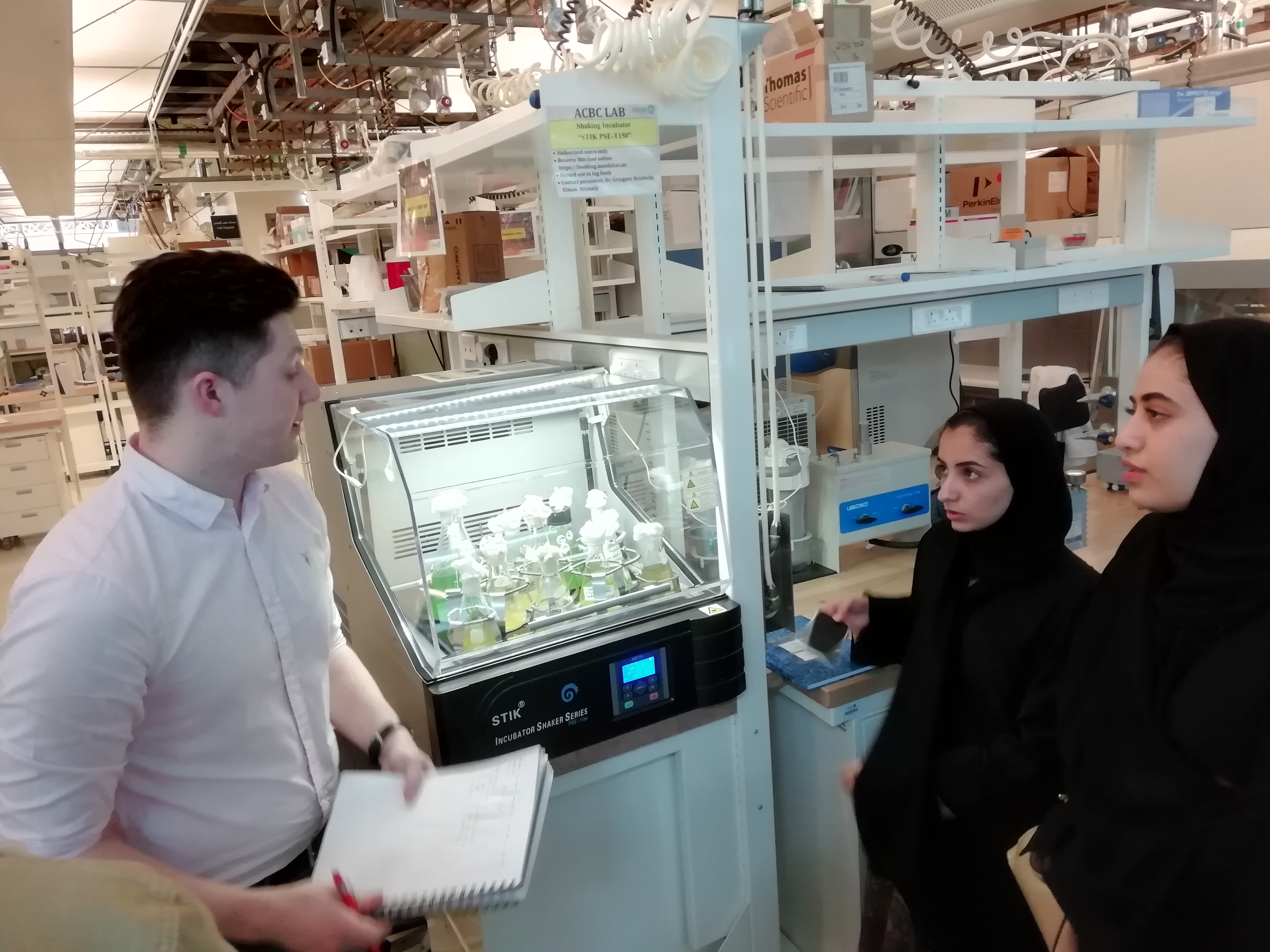 a man and a woman standing in front of a building