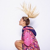 a young girl looking at the camera