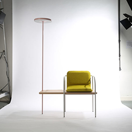 a bedroom with a bed and desk in a room