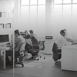 people working in an office office 