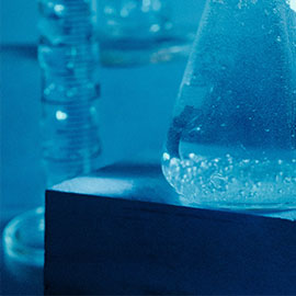 Scientific equipment including test tubes and a measuring jar