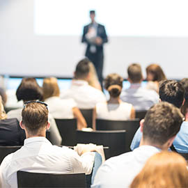 Group of people sat in a seminar