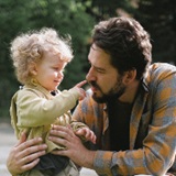 Father and son playing outside