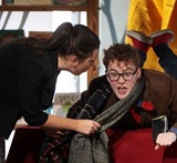 a man and a woman sitting on a table