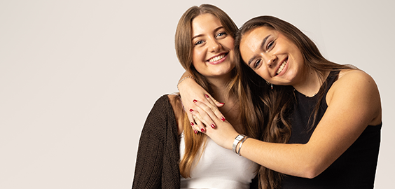 Two female students smiling