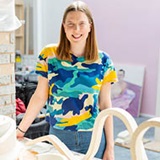 a woman sitting on a table