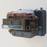 a pile of luggage stacked on top of a vehicle