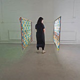 a young boy standing in a room