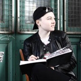 a person sitting in front of a window