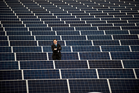 Northumbria University 's Damon Kent With The Solar Array On The Roof Of Sport Central 1 - Web