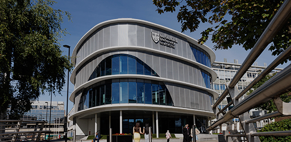 Worms-eye view of the Computer and Information Sciences building on a sunny day