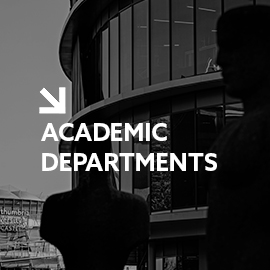 a man standing in front of a building