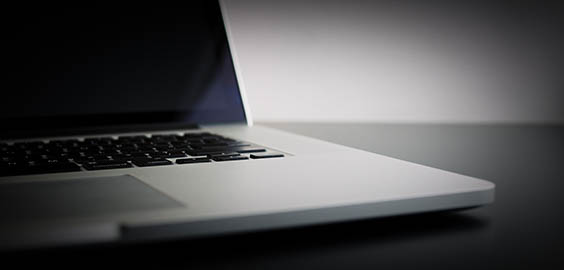 a laptop computer sitting on top of a desk