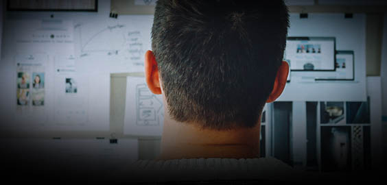 a man standing in front of a screen