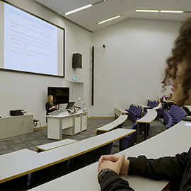 a man and a woman taking a selfie in a room