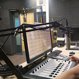 a person standing in front of a computer