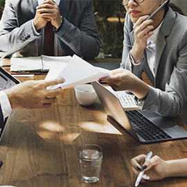 a group of people sitting at a table
