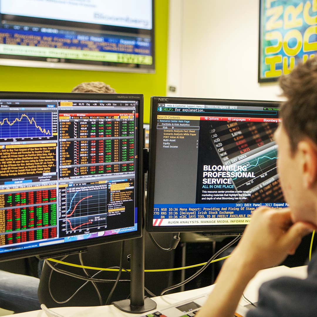 a person sitting in front of a computer